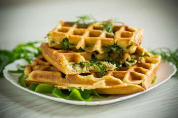 Homemade fried vegetable waffles with herbs inside