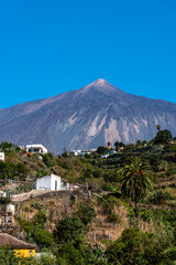 View of the Teide volcano from Icod de los Vinos on a sunny day with blue sky. Tenerife, Canary...