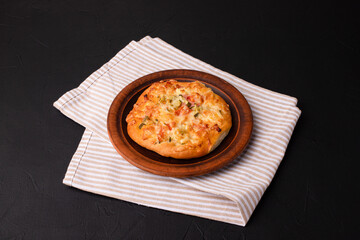 Homemade pizza, pizza on a black background, Georgian cuisine