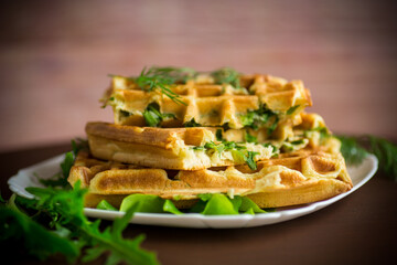 Homemade fried vegetable waffles with herbs inside