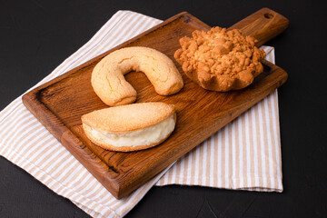 Sausage in dough, sausage in dough on a black background, Georgian cuisine