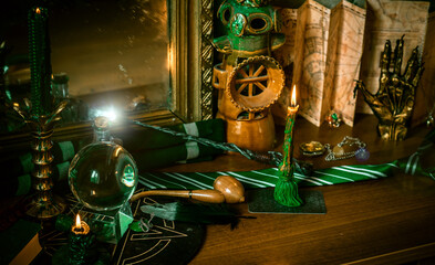 Illustration of magical stuff....candle light, Chrystal ball, magic wand, book of spells dark...