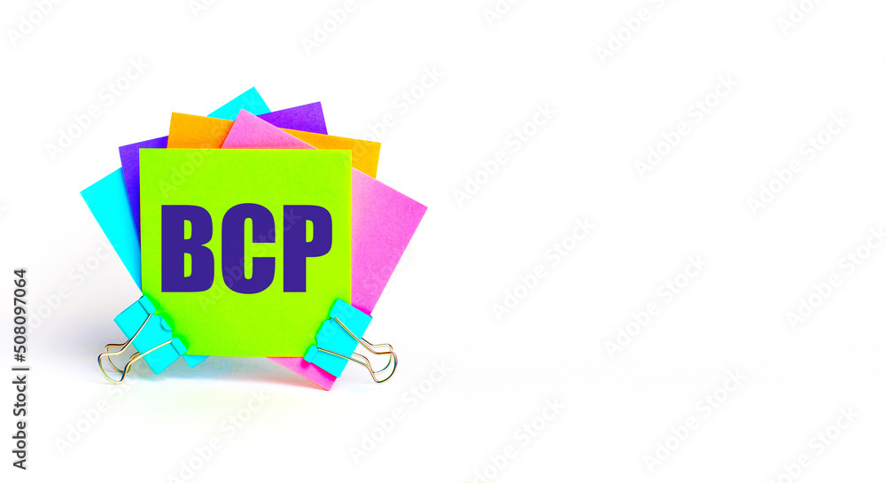 Poster there are bright multi-colored stickers with the text bcp business continuity plan. copy space