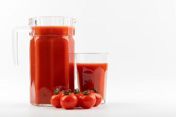 tomato juice and tomatoes on a white