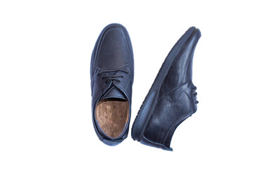 Pair of black leather men's shoes isolated on white background. Top view.	