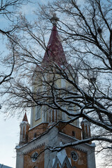 Old church tower with tree outside