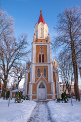 Old church tower with tree outside