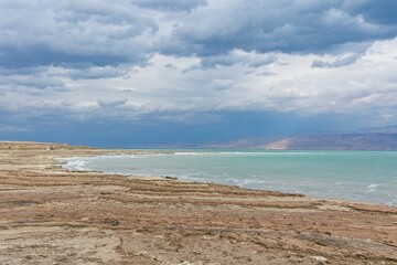 The Dead Sea is a salt lake in Israel at the lowest point on earth of 430 meters below sea level. The drop rate of the sea surface is 1 meter per year causing appearance of sinkholes and salt crystals