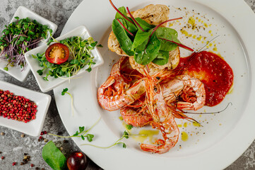 Boiled big shrimps with tomatoe sauce and herbs