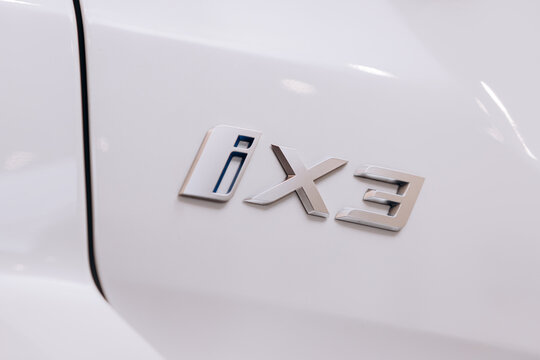 Vinnitsa, Ukraine - January 14, 2022. BMW IX 3 - new model all-electric SUV car presentation in showroom - logo BMW IX 3