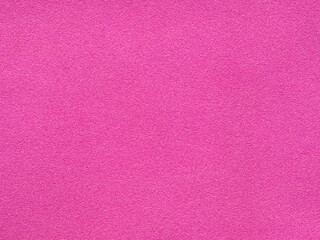 Fototapeta premium The texture of the pink sponge surface is a seamless background. Bright pink textured surface as a background. Crimson texture pattern of abstract background. pink background