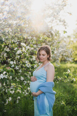 Naklejka na ściany i meble Middle-aged beautiful pregnant woman dreaming about child outdoors. Happy expectant thinking about baby and enjoying her future life. Motherhood, pregnancy, happiness, health care concept, copy space.