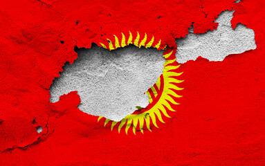 Graphic Concept of a damaged Flag of Kyrgyzstan painted on a wall.