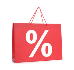 Red paper shopping bag with percent sign on white background. Discount concept