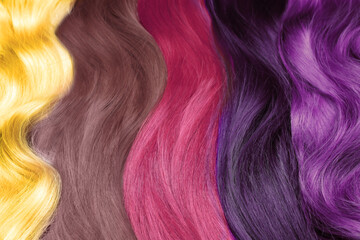 Strands of beautiful multicolored hair as background, closeup