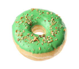 Sweet tasty glazed donut decorated with nuts isolated on white
