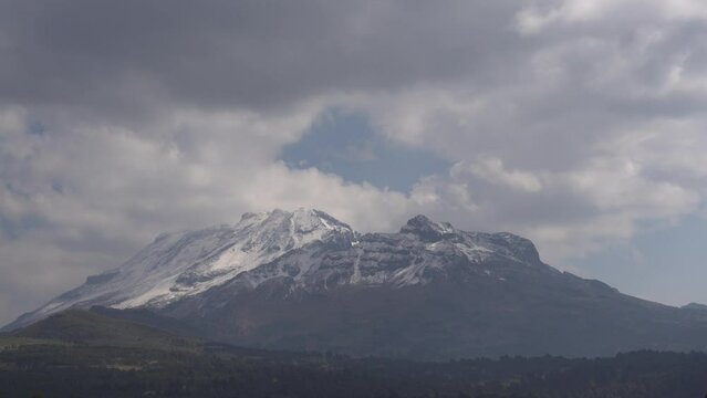 Top of Iztaccihuatl volcano covered with snow.