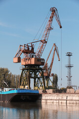 Port crane works on the river coast
