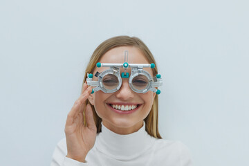 Eyesight Test. Cheerful Blonde Woman With Natural Face Makeup Smiling Toothy In Optometrist Trial...