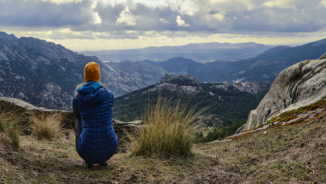 Woman looking at the landscape in the mountains