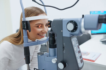 Eyesight Exam. Woman Checking Eye Vision On Optometry Equipment. Woman Getting Vision Test with Binocular Slit-lamp at Ophthalmology Clinic