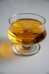 Glass of apple cider drink on white table, Normandy, France