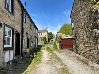 Fototapeta na wymiar Small side street, on a sunny day in the village of, Cononley, Keighley, UK