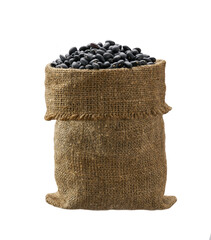 Raw black beans in sack isolated on white background.