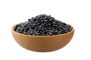 Raw black beans in a wooden bowl isolated on white background.