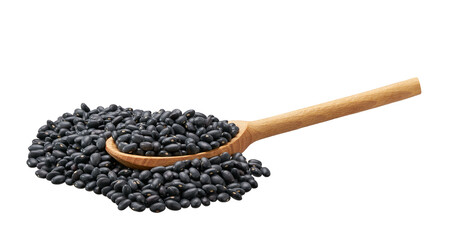 black beans crumble from a wooden spoon isolated on white background.
