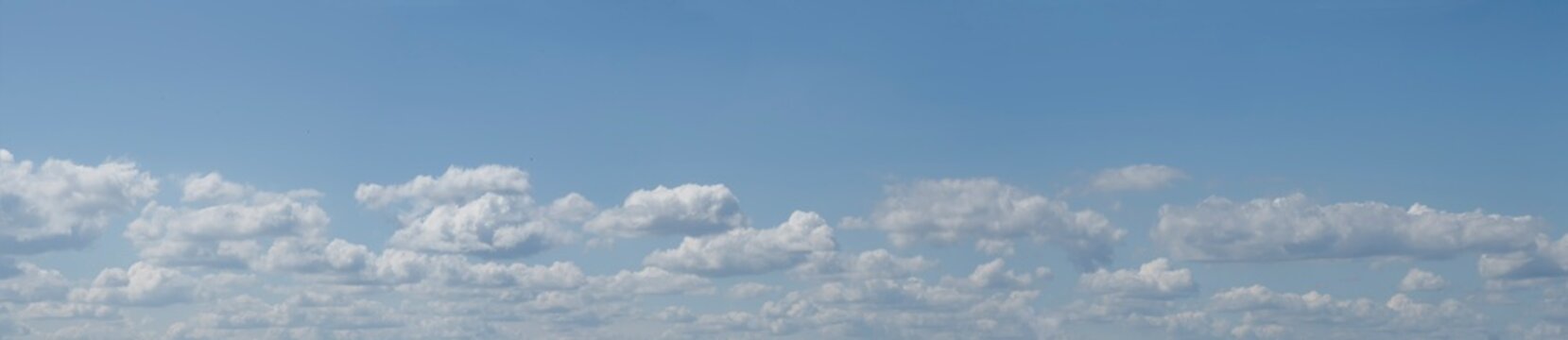 Panoramic photo of blue cloudy sky 