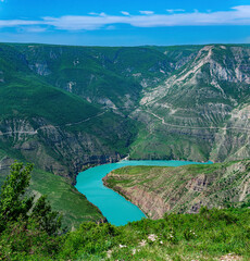 Fototapeta na wymiar mountain landscape, view of the deep canyon with blue water, valley of the Sulak river in Dagestan