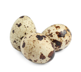 Obraz premium Three beautiful quail eggs on white background