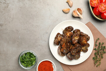 Delicious kidneys and ingredients on light table, flat lay. Space for text