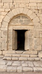 Fototapeta na wymiar Perfect rare old stone arch in Arzaq, Jordan. High quality photo