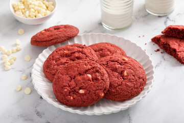 Red velvet cookies with white chocolate chips with milk