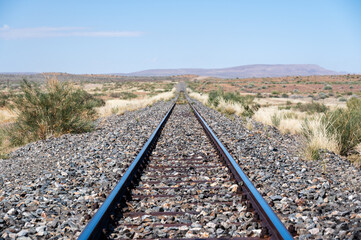 Railway tracks and train journey in typical African savanna landscape, Namibia, Africa