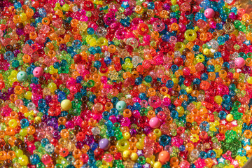 Fototapeta na wymiar A very colorful background of sparkling beads