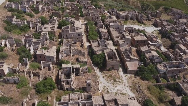 Aerial drone view of the ruins of Poggioreale on the Belice valley, in the province of Trapani. The town was destroyed by and earthquake in 1968. Abandoned empty eerie ghost town in Sicily.