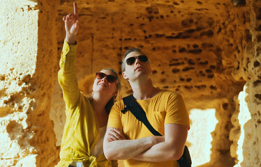 Couple visiting Tombs of the Kings in Paphos.