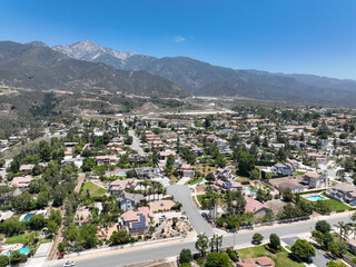 Fototapeta na wymiar Aerial view of wealthy Alta Loma community and mountain range, Rancho Cucamonga, California, United States
