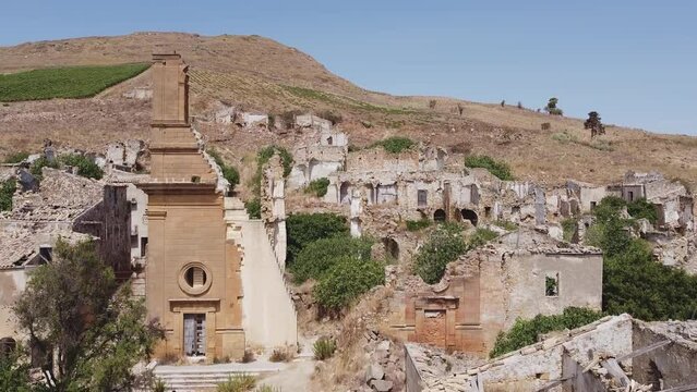 Aerial drone view of the ruins of Poggioreale on the Belice valley, in the province of Trapani. The town was destroyed by and earthquake in 1968. Abandoned empty eerie ghost town in Sicily.