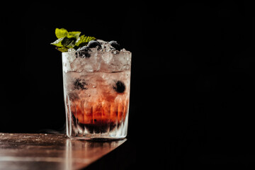 Cocktail with blueberries and mint