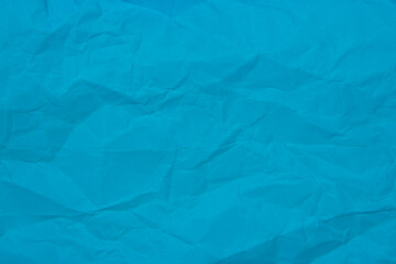 Crumpled blue paper craft textured background