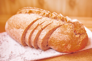 Fresh loaf of bread on the table, wheat baked food