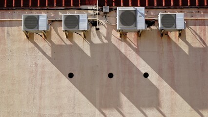air conditioning machines in industrial facade