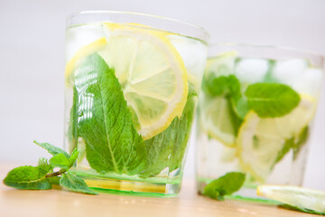 Refreshing summer mojito cocktail drink with lemon, mint and ice ingredient
