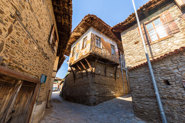 Architecture stone buildings, traditional Turkish village houses in touristic place Birgi, Izmir. - obrazy, fototapety, plakaty
