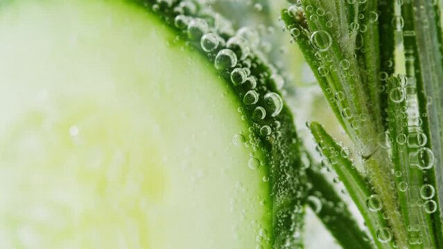 Lemonade with Cucumber and rosemary texture. Gin tonic cocktail close-up macro, healthy drink. Detox drinking, summer refreshment concept.