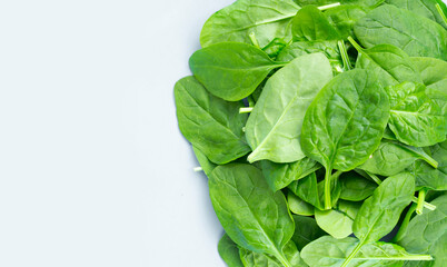 Spinach leaves on white background.